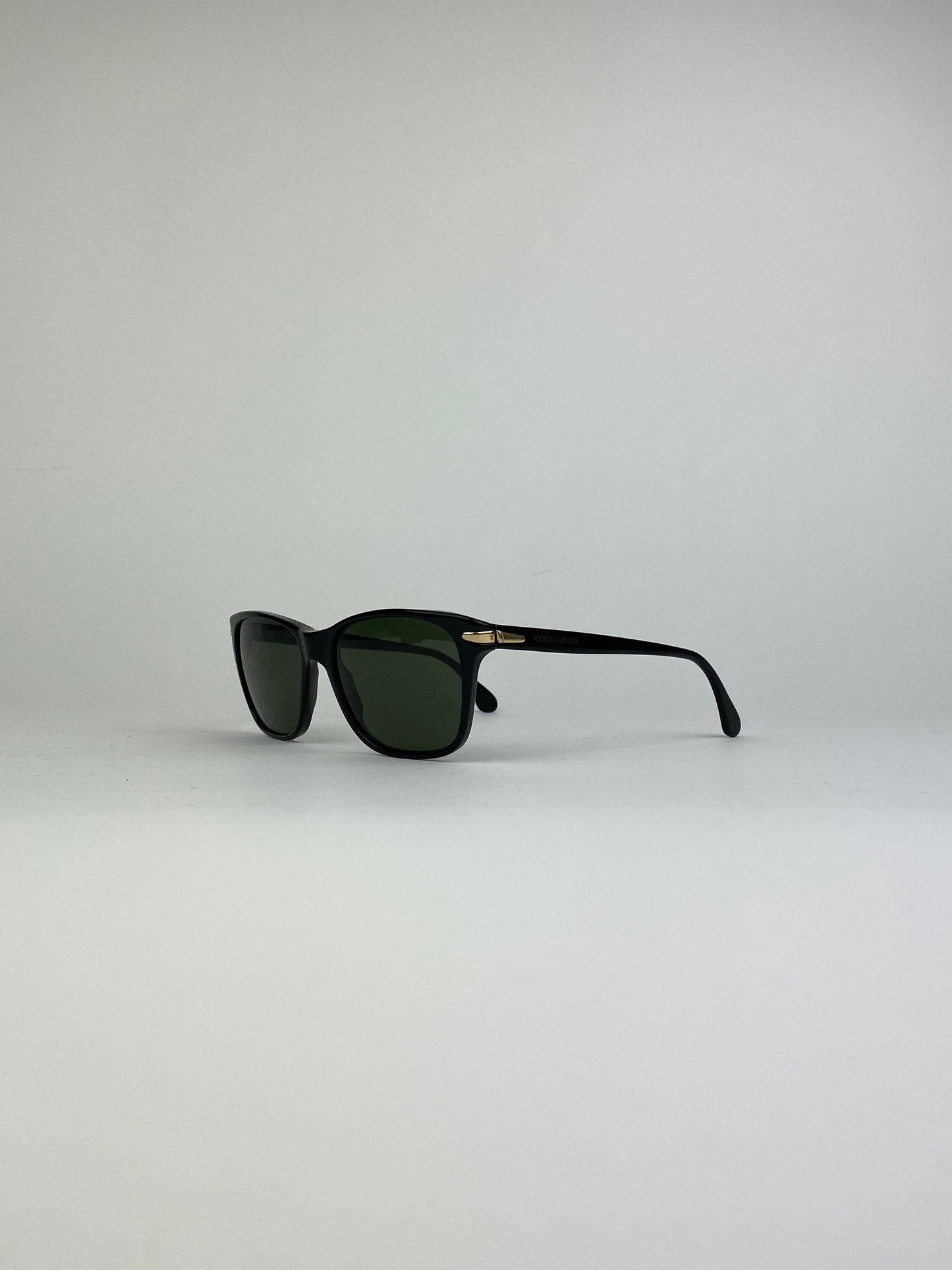 Black Giorgio Armani Wayfarer sunglasses with sleek frame and dark lenses, stylish and iconic eyewear for men and women.