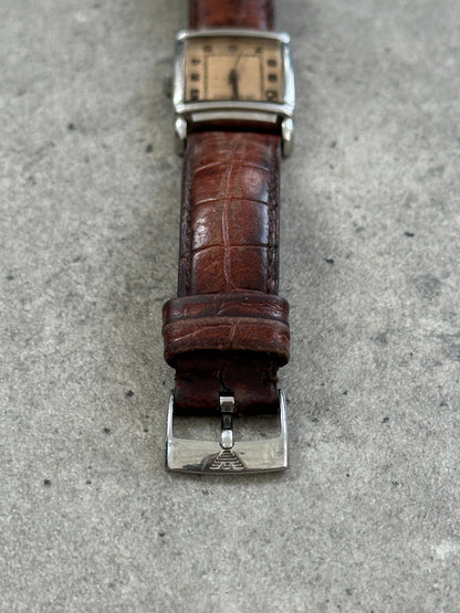 Emporio Armani 2000s leather rectangular quartz watch with black dial, silver-tone case, and brown leather strap.