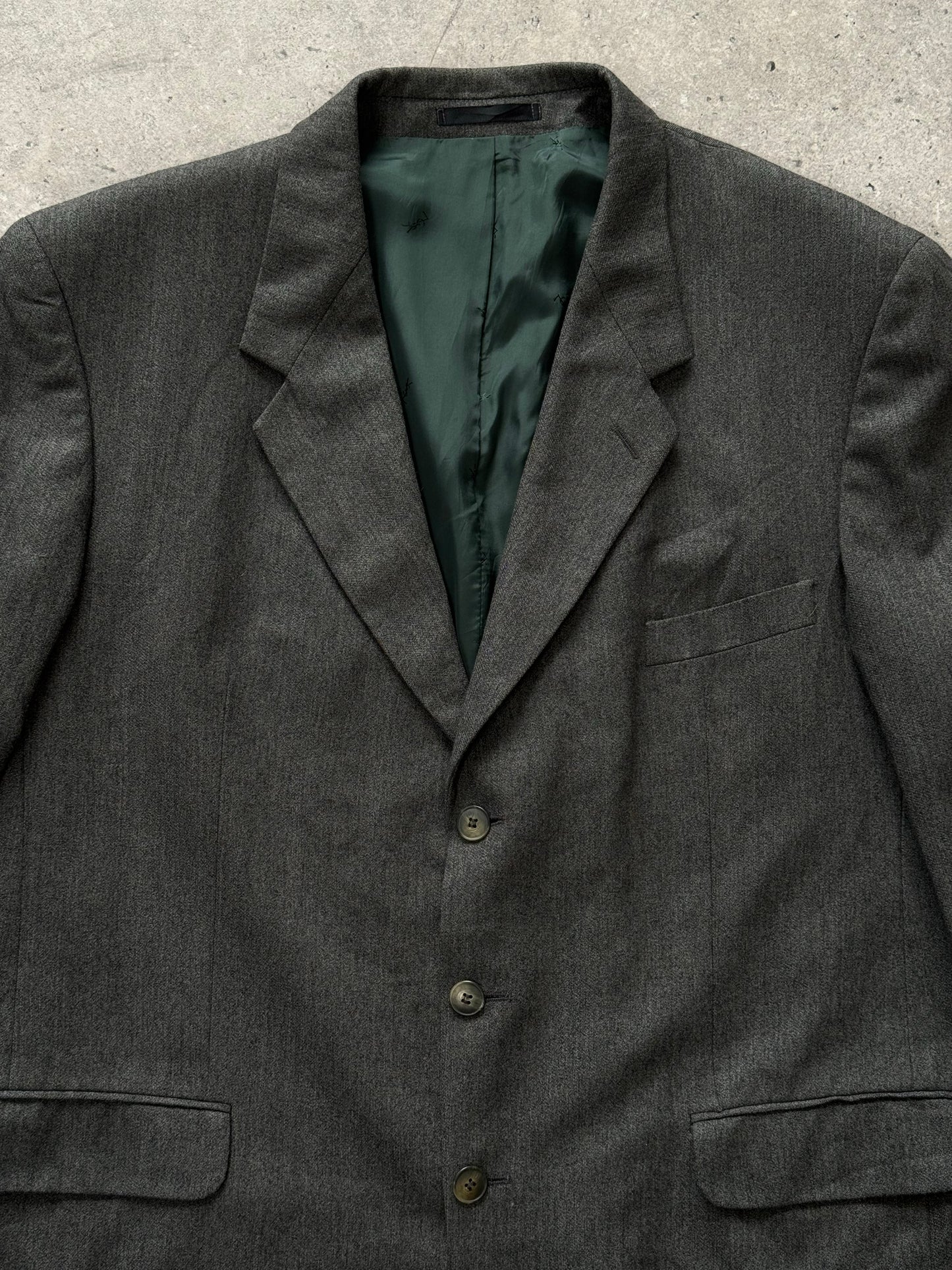 Yves Saint Laurent Pour Homme 1990s pure wool single-breasted blazer in size 46R, shown on a hanger with front view.