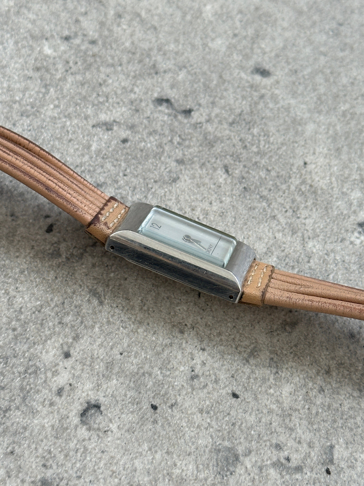 Donna Karran DKNY 2000s leather rectangular quartz watch with a sleek design and classic brown leather strap.