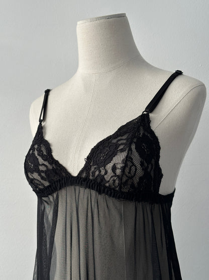 Vintage 2000s sheer sleeveless babydoll top, size small, with delicate fabric and vintage style, displayed on a plain background.