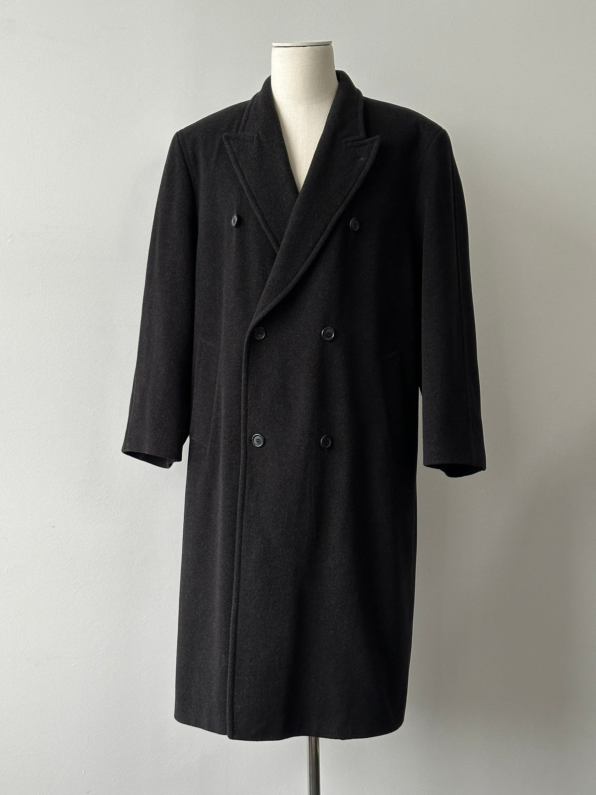 Vintage 1990s pure wool double-breasted coat in size XL, showcasing classic design and textured fabric.