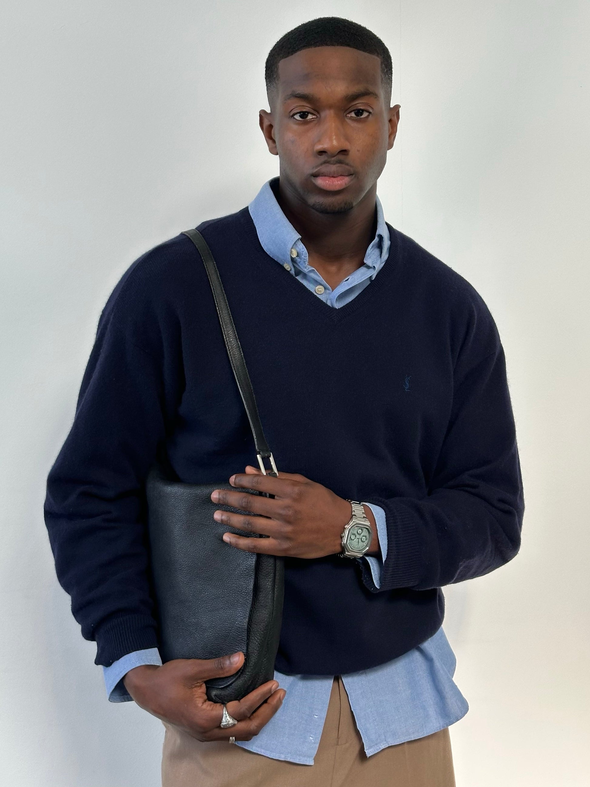 Yves Saint Laurent Pour Homme 1990s wool V-neck jumper in size L, navy blue sweater displayed on a hanger.