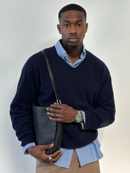 Yves Saint Laurent Pour Homme 1990s wool V-neck jumper in size L, navy blue sweater displayed on a hanger.