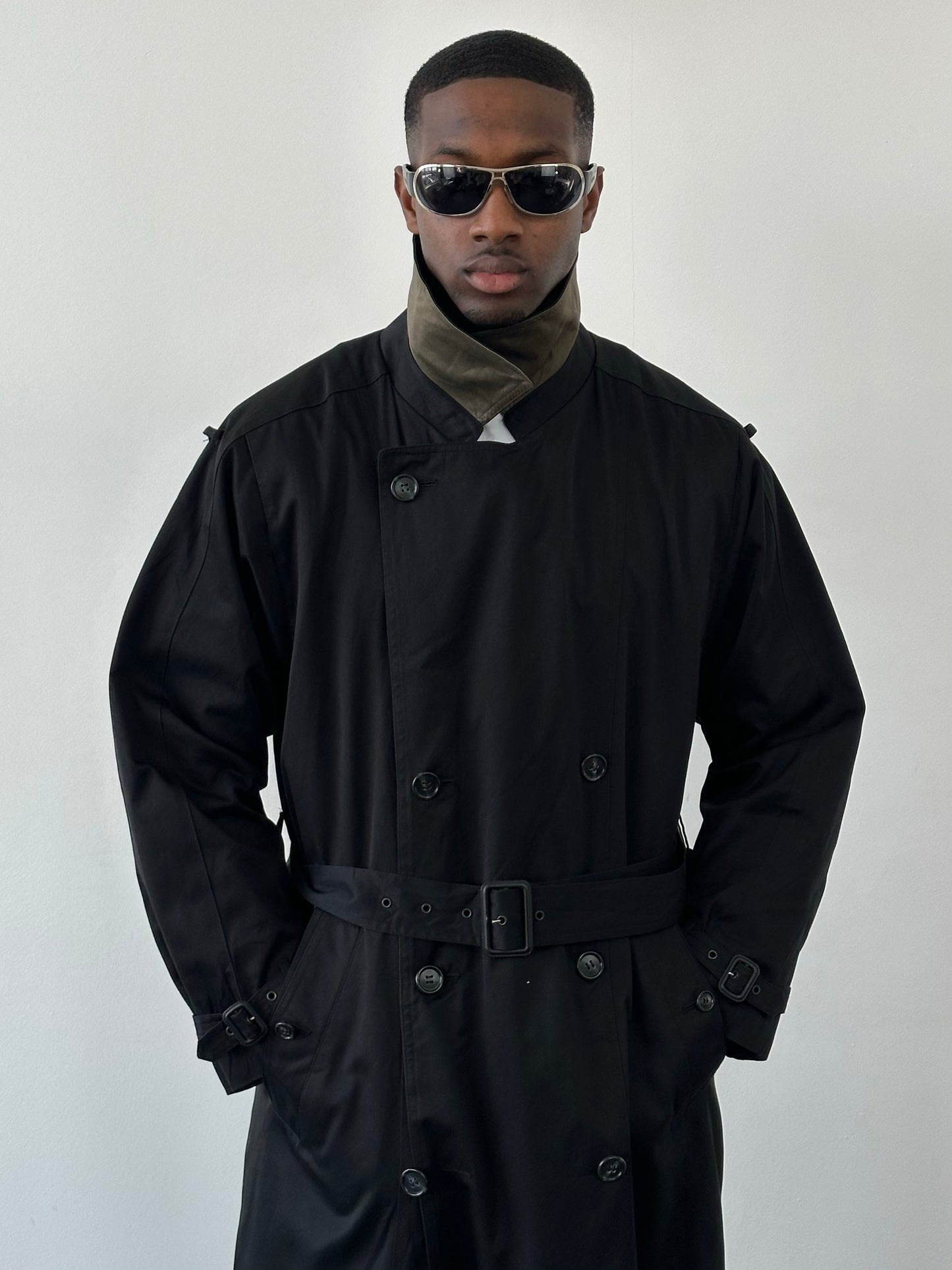 London Fog Towne 1990s double-breasted belted trench coat, beige color, shown on a model with classic collar and waist belt.
