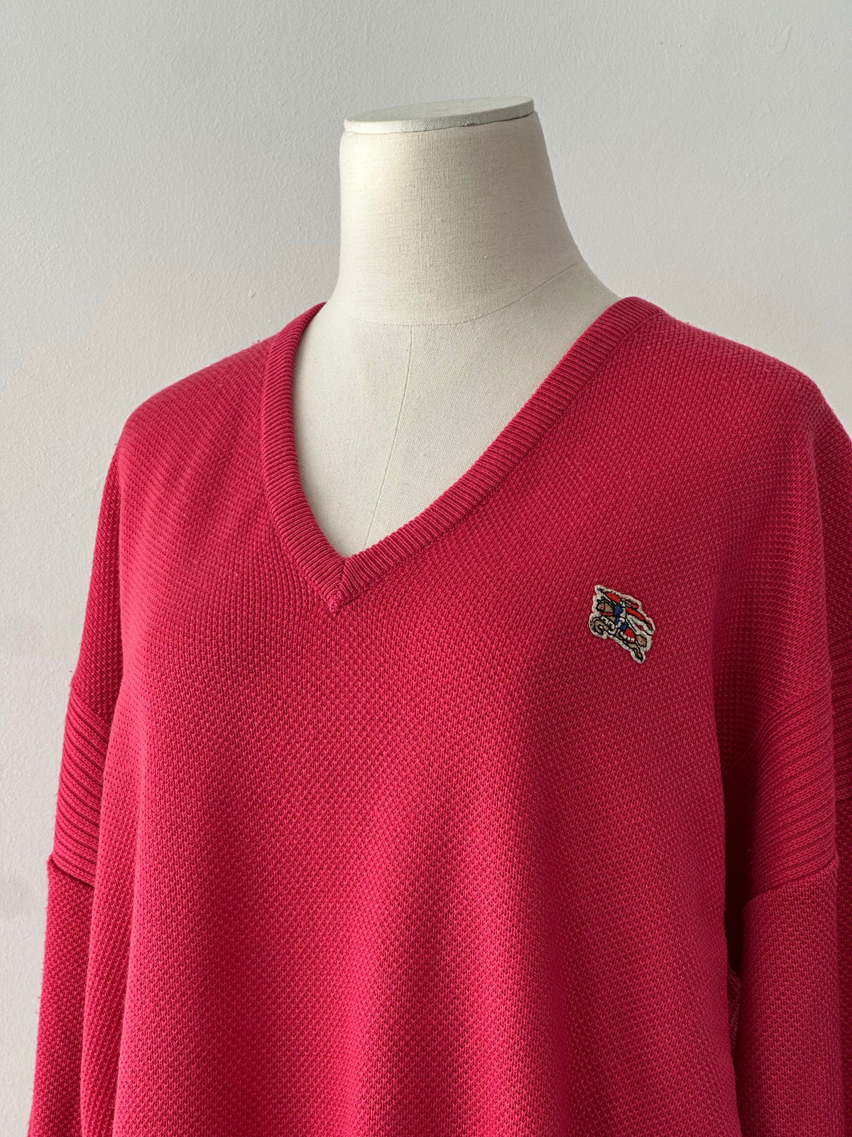 Burberry 1980s V-neck logo knit jumper in size L, classic beige and check pattern, soft wool blend, vintage fashion style.