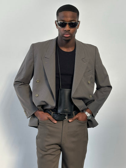 Yves Saint Laurent 1990s double-breasted wool blazer in classic black, tailored fit, with wide lapels and button closure.