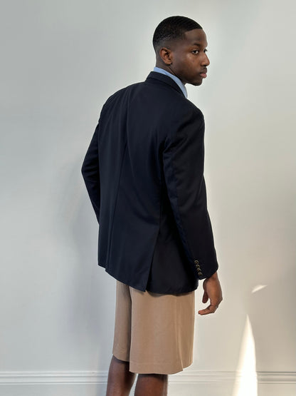 Burberry 1990s bespoke button wool double-breasted blazer in navy, size 42R/XL, displayed on a hanger with detailed fabric texture.