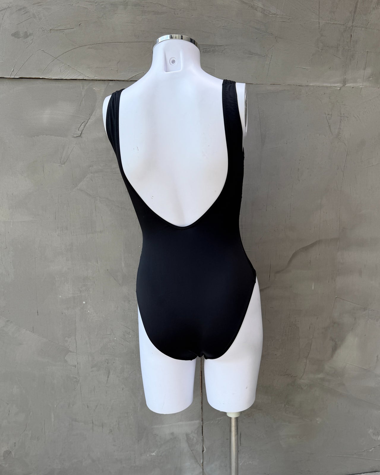 Christian Dior Black Nylon Elastane Swimsuit-on a concrete background