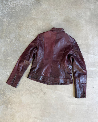 Transmission New York Oxblood Red Leather Jacket – L-on a concrete background