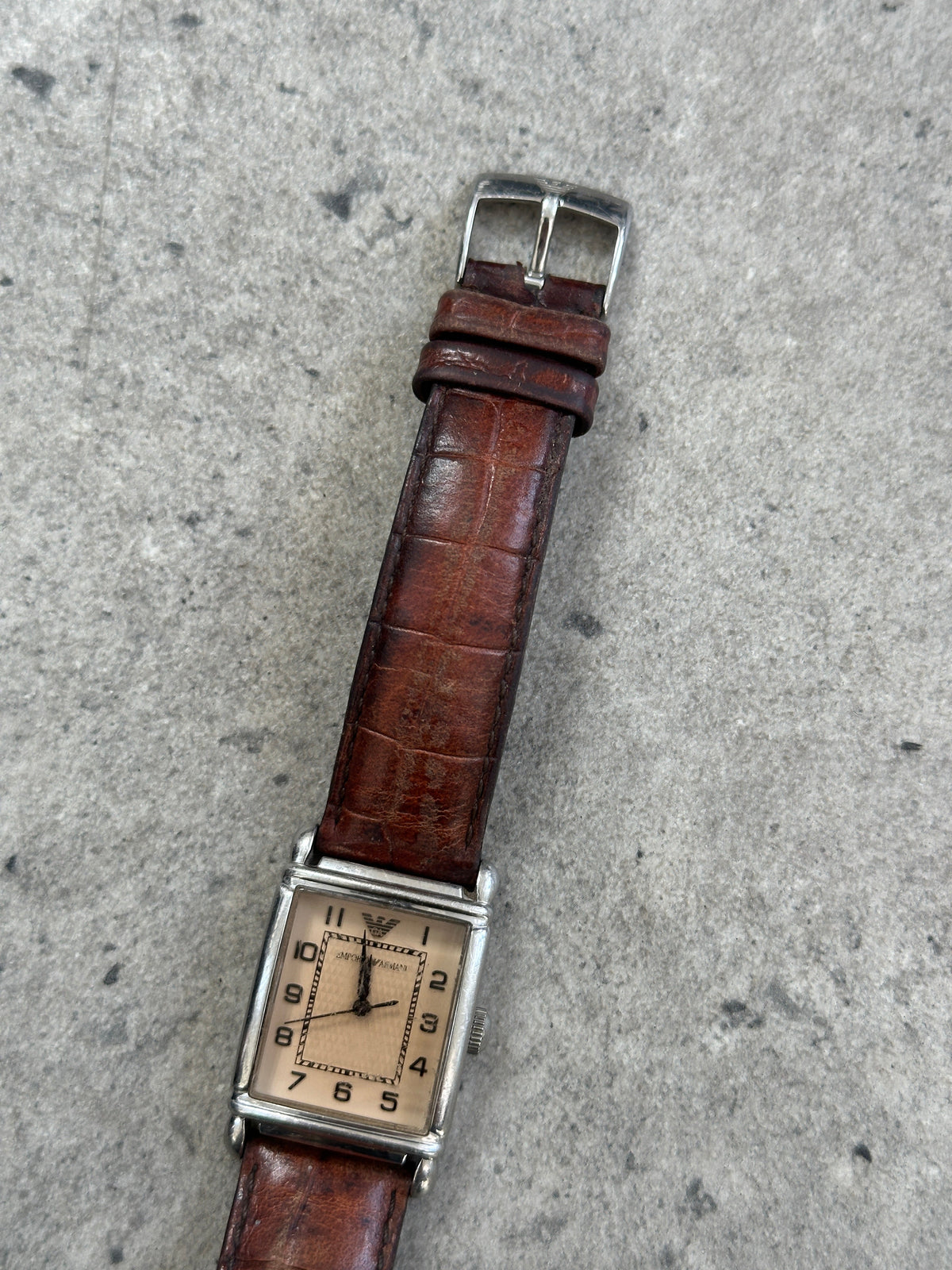 Emporio Armani 2000s leather rectangular quartz watch with silver dial and black leather strap, showcasing classic luxury style.