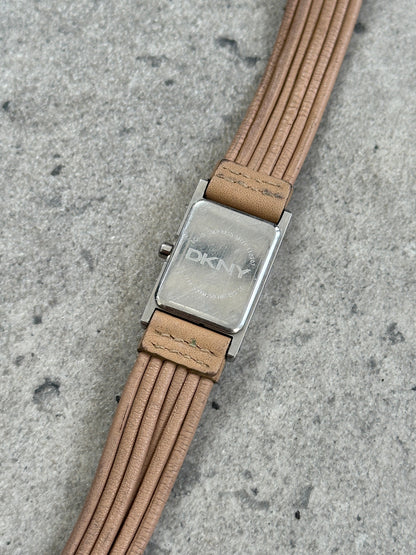 Donna Karran DKNY leather rectangular quartz watch with a classic design, featuring a black strap and silver-tone dial.