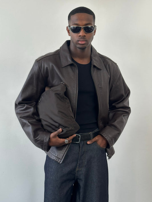 Vintage 1990s boxy minimal leather jacket in XL, featuring a classic design and authentic leather texture.