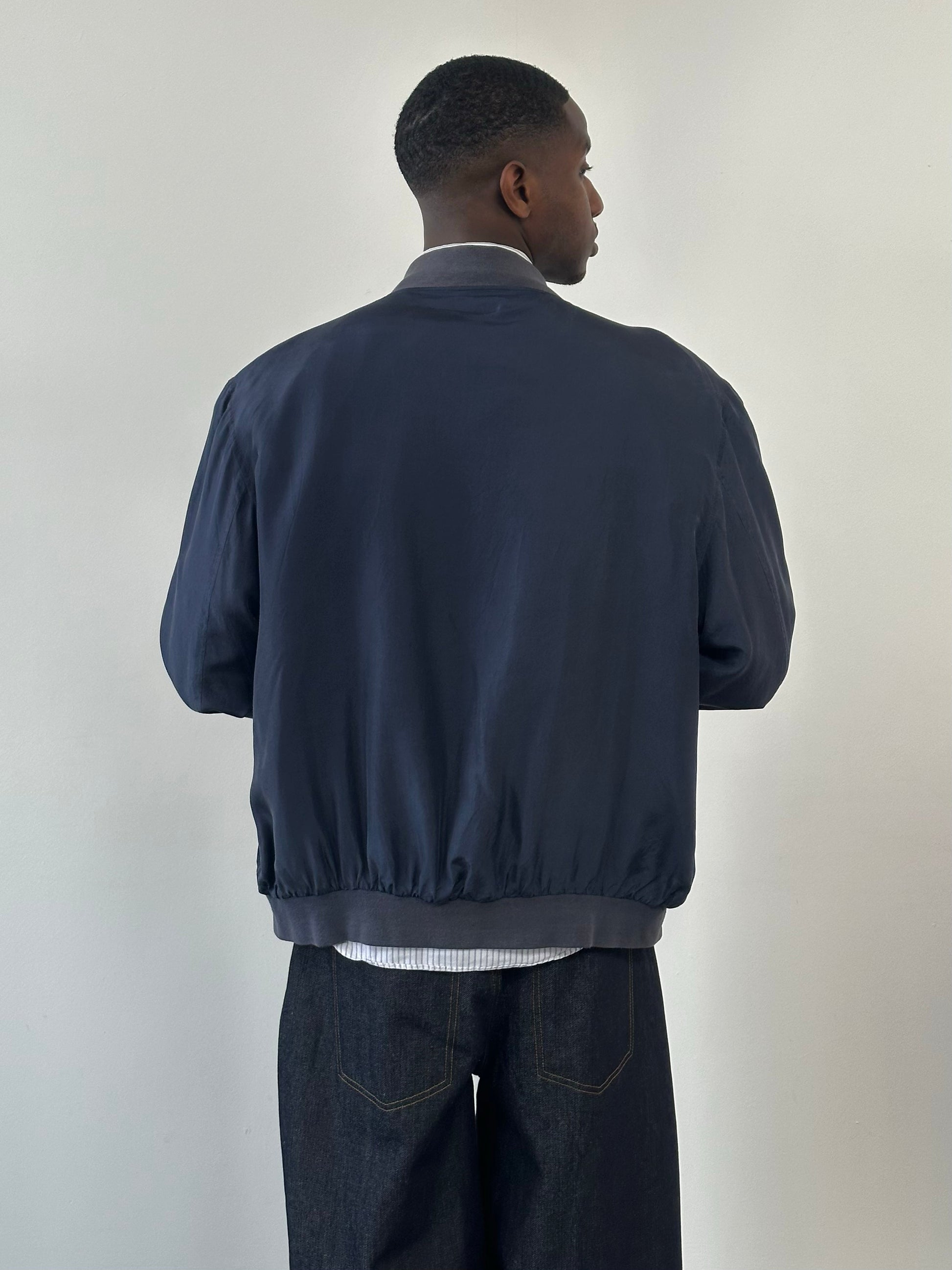 Vintage 1990s pure silk boxy bomber jacket, size large, with a smooth, shiny finish and classic retro style.