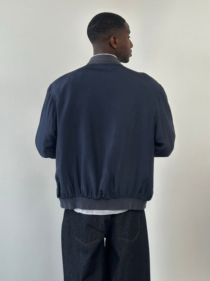 Vintage 1990s pure silk boxy bomber jacket, size large, with a smooth, shiny finish and classic retro style.