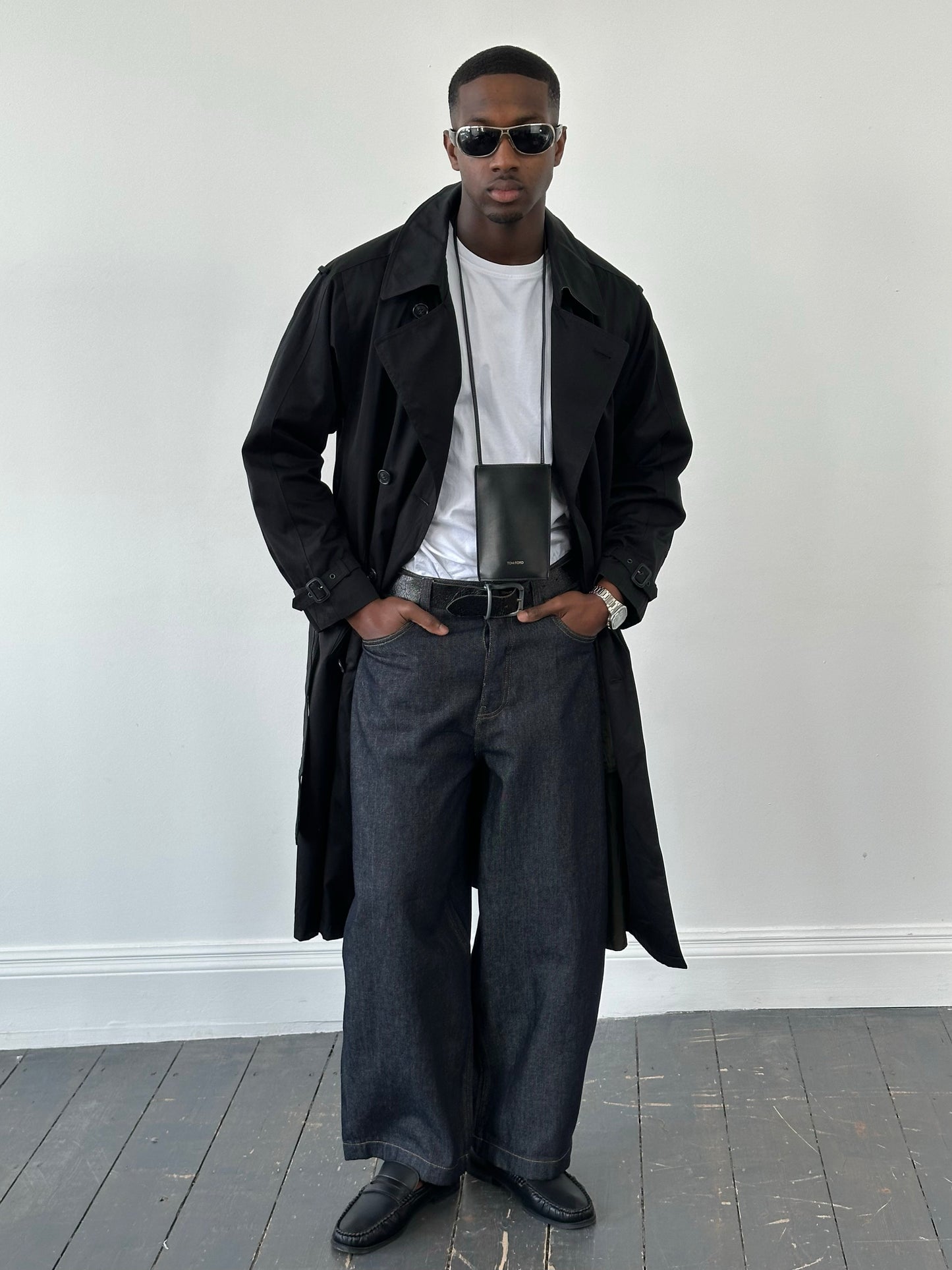 London Fog Towne 1990s double-breasted belted trench coat displayed on a model, classic beige color, mid-length style.