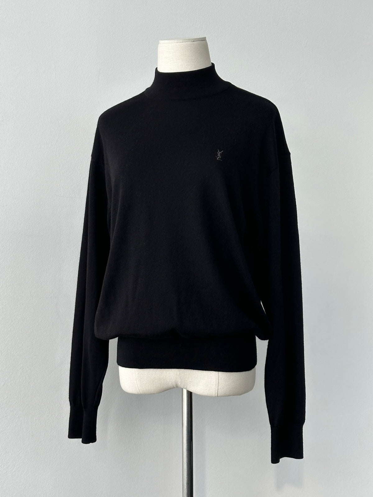 Yves Saint Laurent 1990s wool high neck jumper in size M, dark color, showcasing a cozy, fitted high-neck design.