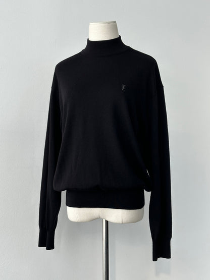 Yves Saint Laurent 1990s wool high neck jumper in size M, dark color, showcasing a cozy, fitted high-neck design.
