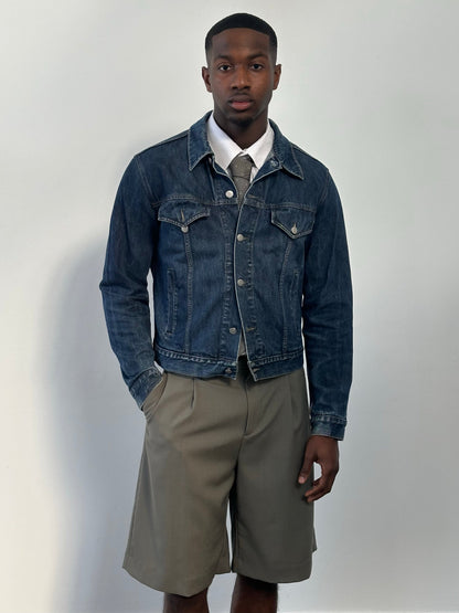 Armani Jeans 1990s pure cotton denim jacket with classic fit, button closure, and chest pockets, displayed on a hanger.