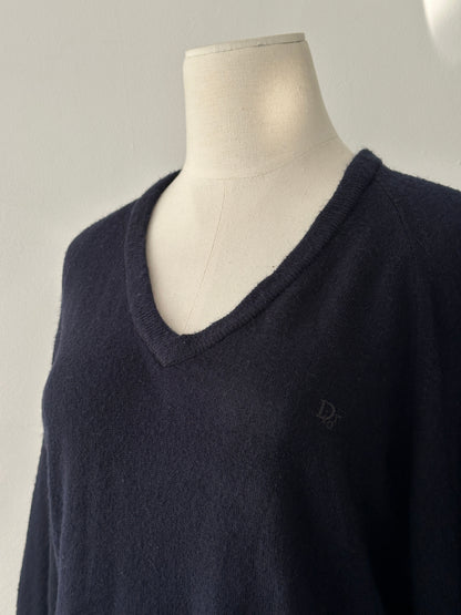Christian Dior 1990s V-neck logo jumper in black, featuring Dior branding and a classic fit, displayed on a mannequin.