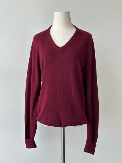 Christian Dior 1990s V-neck logo jumper in black, featuring the Dior brand logo on the chest and a classic V-neck design.