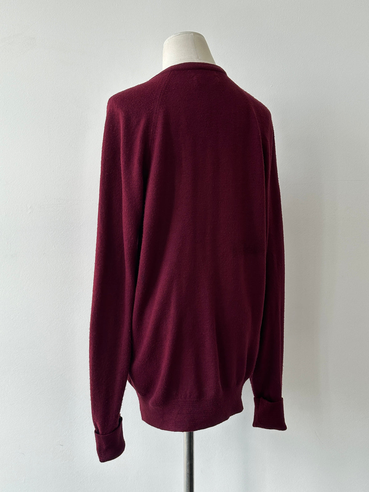 Christian Dior 1990s V-neck logo jumper in black, featuring the iconic Dior logo on the chest, size M, classic vintage style.