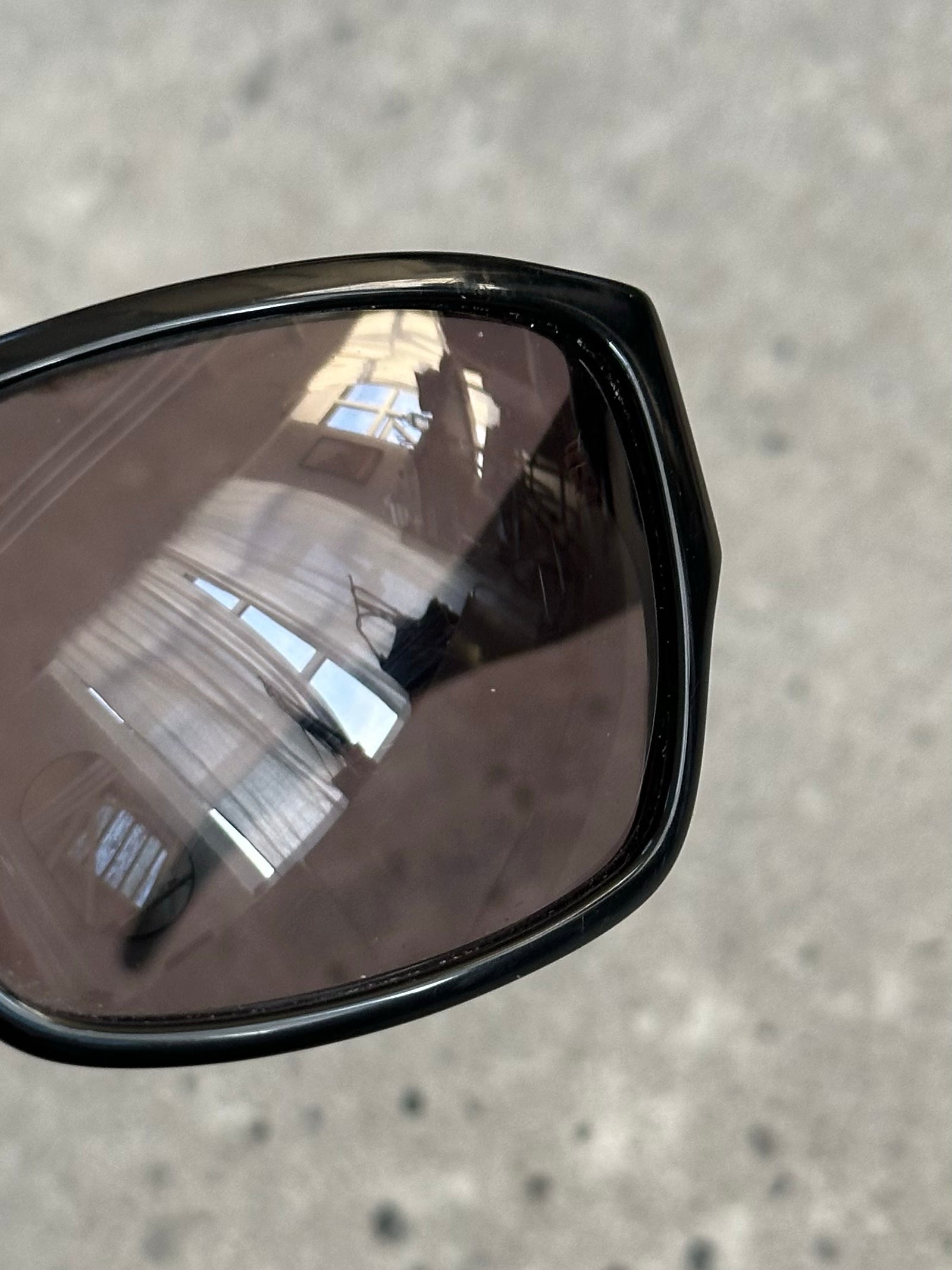 Dolce & Gabbana 2000s rectangle logo sunglasses with black frames and dark tinted lenses, stylish and iconic eyewear.