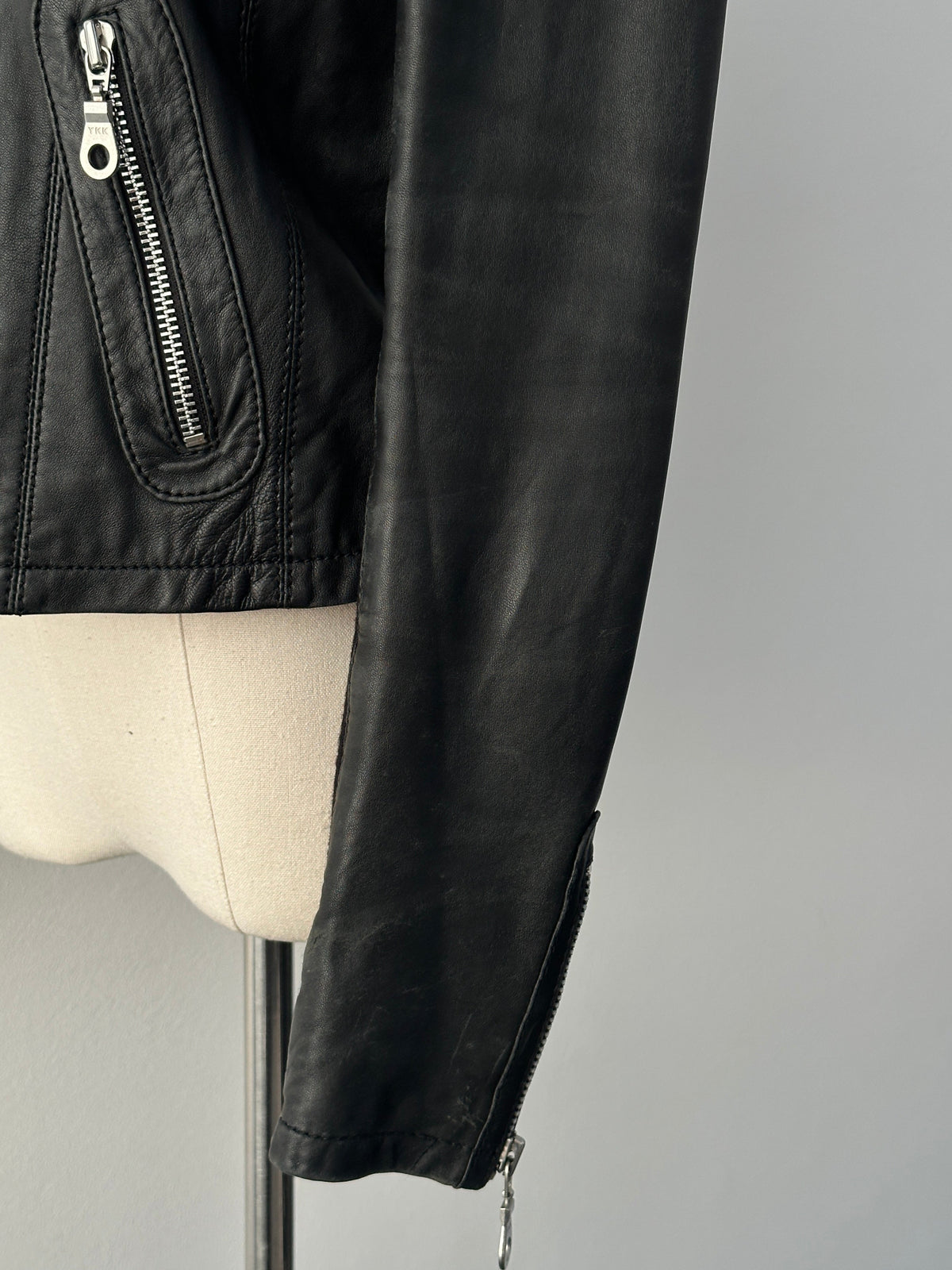 Vintage 2000s fitted lamb leather moto jacket in XS, stylish and classic leather jacket with a vintage design.