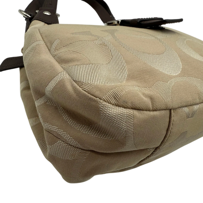 https://cdn.shopify.com/s/files/1/0564/9376/8855/files/coach-shopper-signature-beige-premium-handbag-chic-canvas-logo-style47.webp?v=1777464010