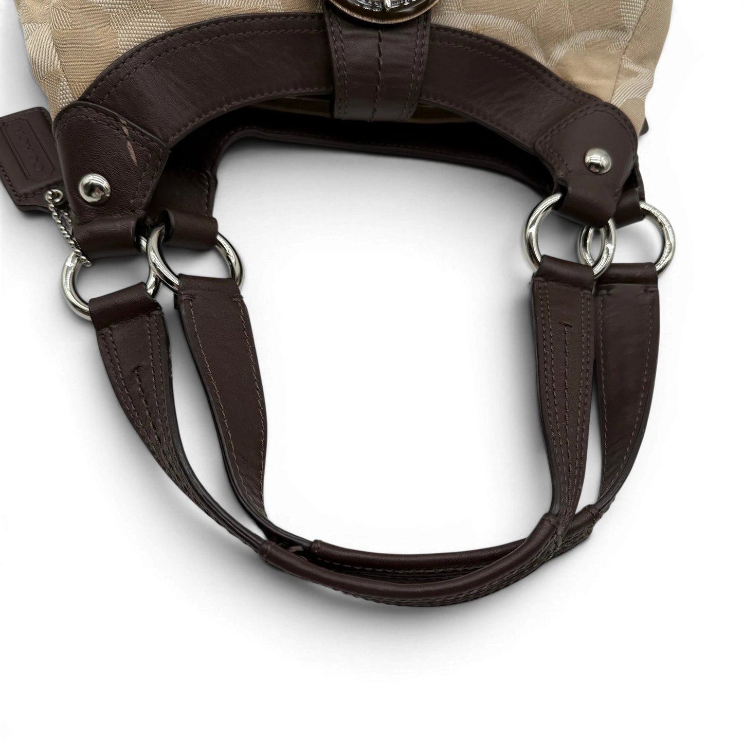 https://cdn.shopify.com/s/files/1/0564/9376/8855/files/coach-shopper-signature-beige-premium-handbag-chic-canvas-logo-style51.webp?v=1777464010