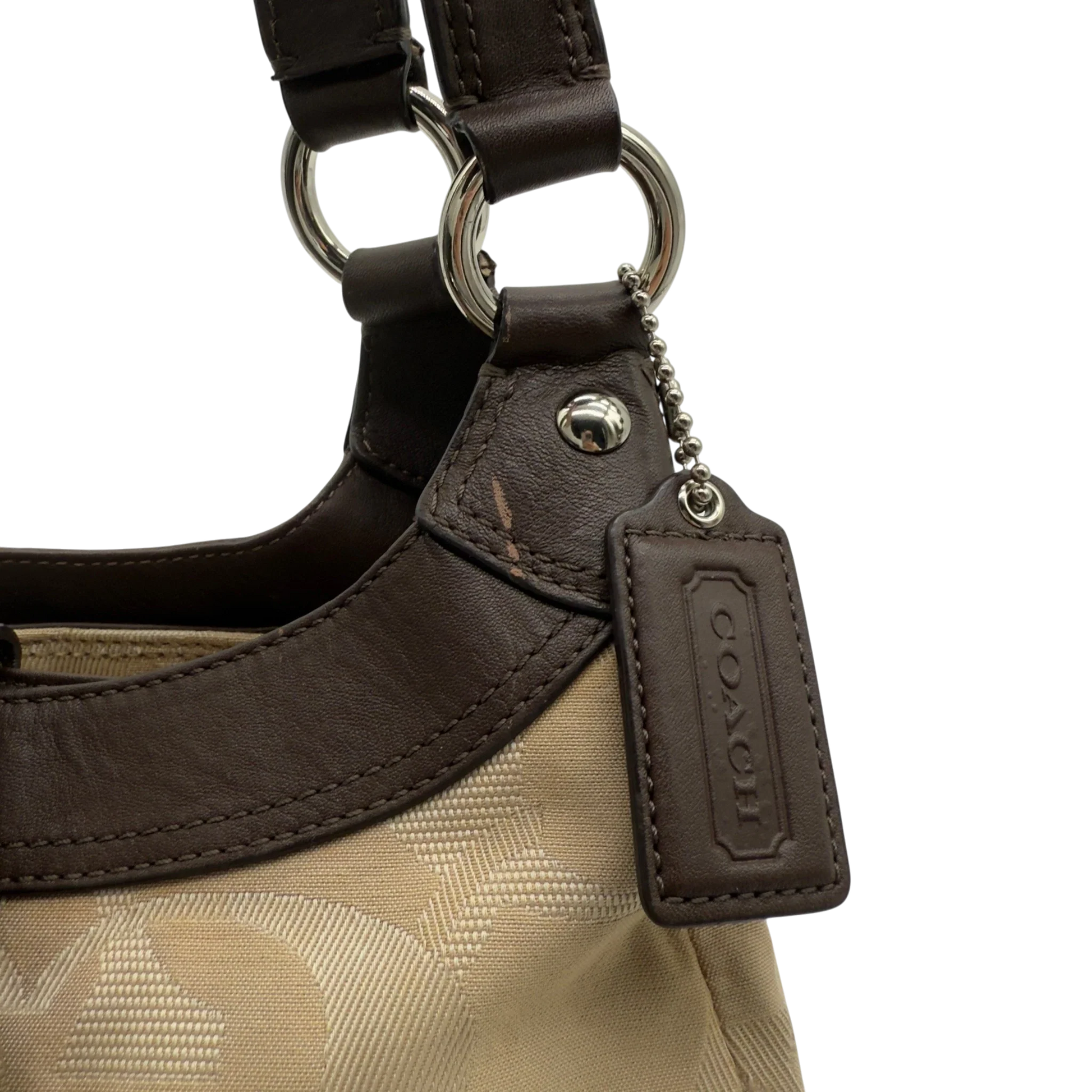 https://cdn.shopify.com/s/files/1/0564/9376/8855/files/coach-shopper-signature-beige-premium-handbag-chic-canvas-logo-style56.webp?v=1777464010