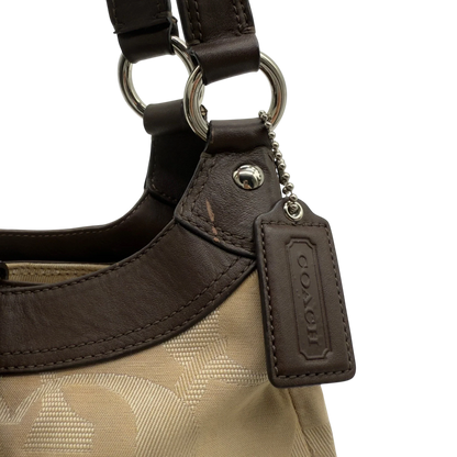 https://cdn.shopify.com/s/files/1/0564/9376/8855/files/coach-shopper-signature-beige-premium-handbag-chic-canvas-logo-style56.webp?v=1777464010