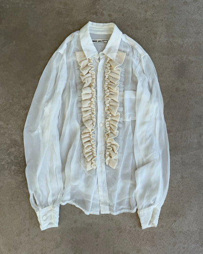 Comme des Garçons Sheer White Shirt-on a concrete background