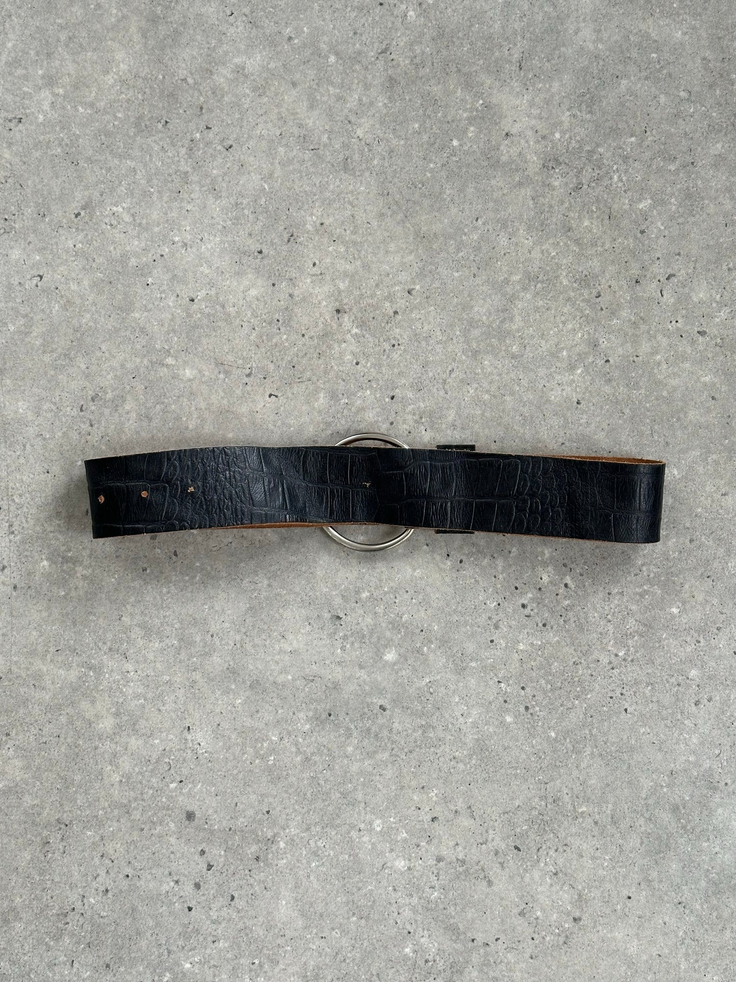 Vintage 1990s circular leather chunky belt with large round buckle, showcasing distressed leather and bold vintage style.
