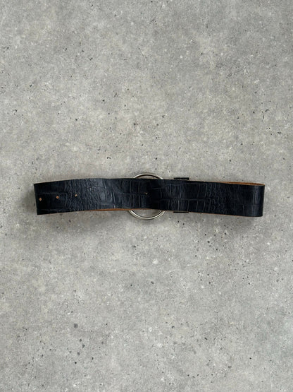 Vintage 1990s circular leather chunky belt with large round buckle, showcasing distressed leather and bold vintage style.