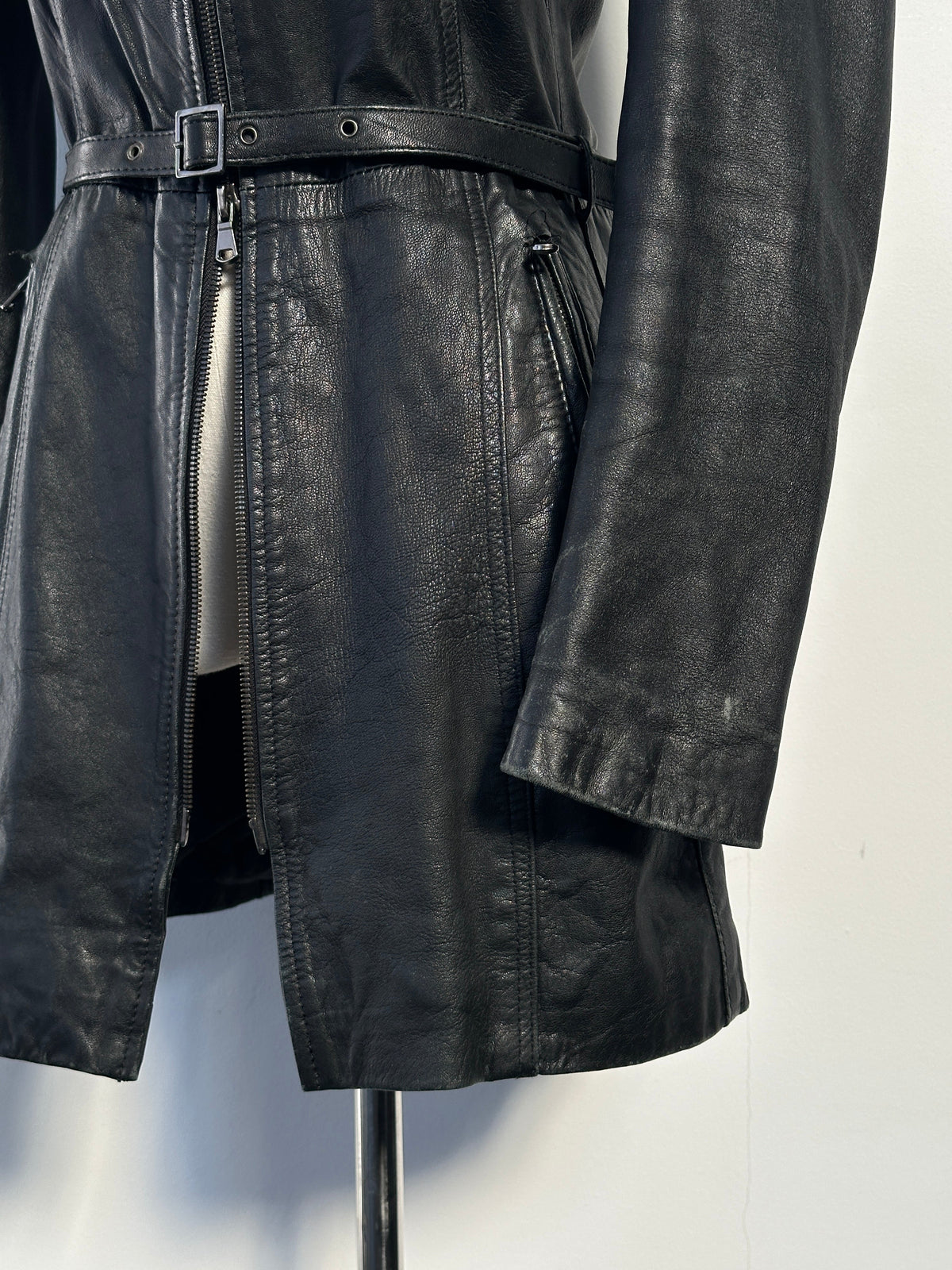 Italian vintage 1990s double zip belted leather jacket in XS, showing classic design and textured leather from the front.
