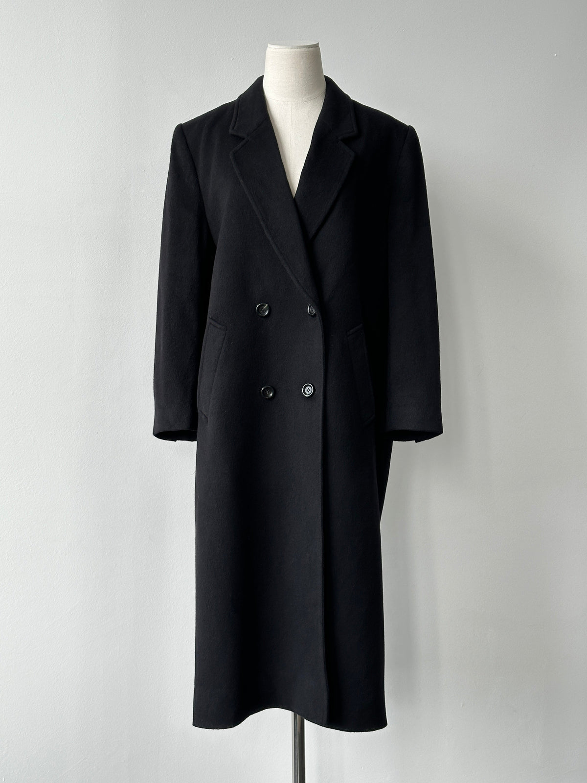 Vintage 1990s pure cashmere double-breasted coat, stylish and warm, shown in classic beige with lapels and button details.