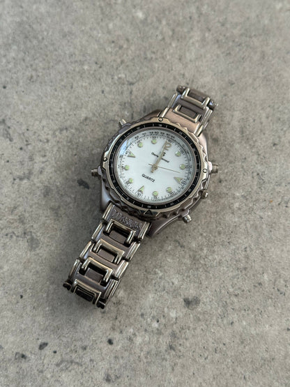 Vintage 1990s Titanium Quartz Sports Watch with black dial, stainless steel case, and sporty design.