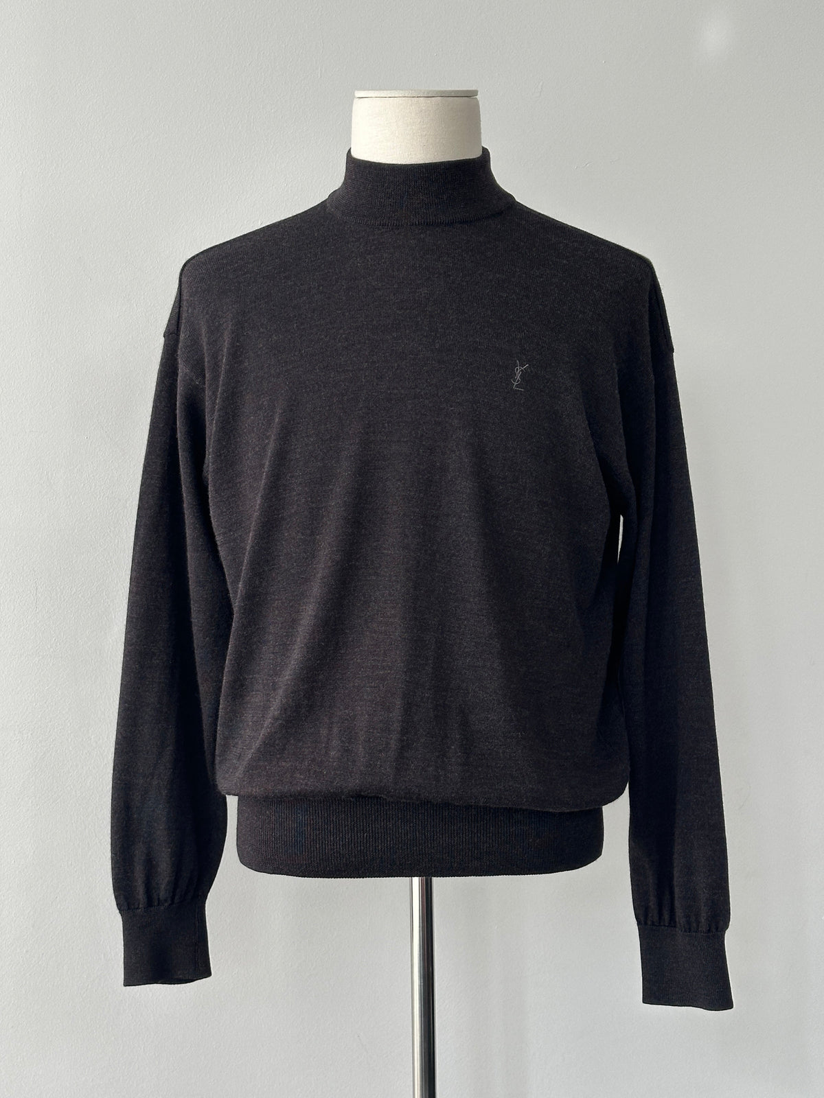 Yves Saint Laurent 1990s wool high neck jumper in size M, featuring a classic high neckline and textured knit fabric.