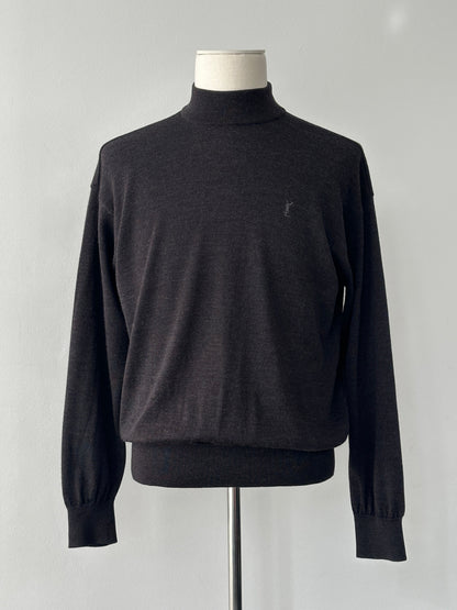 Yves Saint Laurent 1990s wool high neck jumper in size M, featuring a classic high neckline and textured knit fabric.