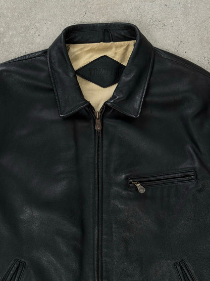 Vintage 1990s heavyweight leather jacket in XXL, minimal design, rugged leather texture, classic vintage style.
