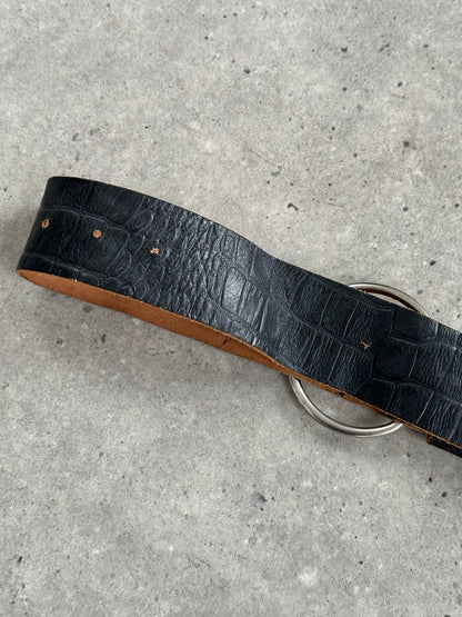Vintage 1990s circular leather chunky belt with bold design, featuring a large round buckle, in rich brown leather.