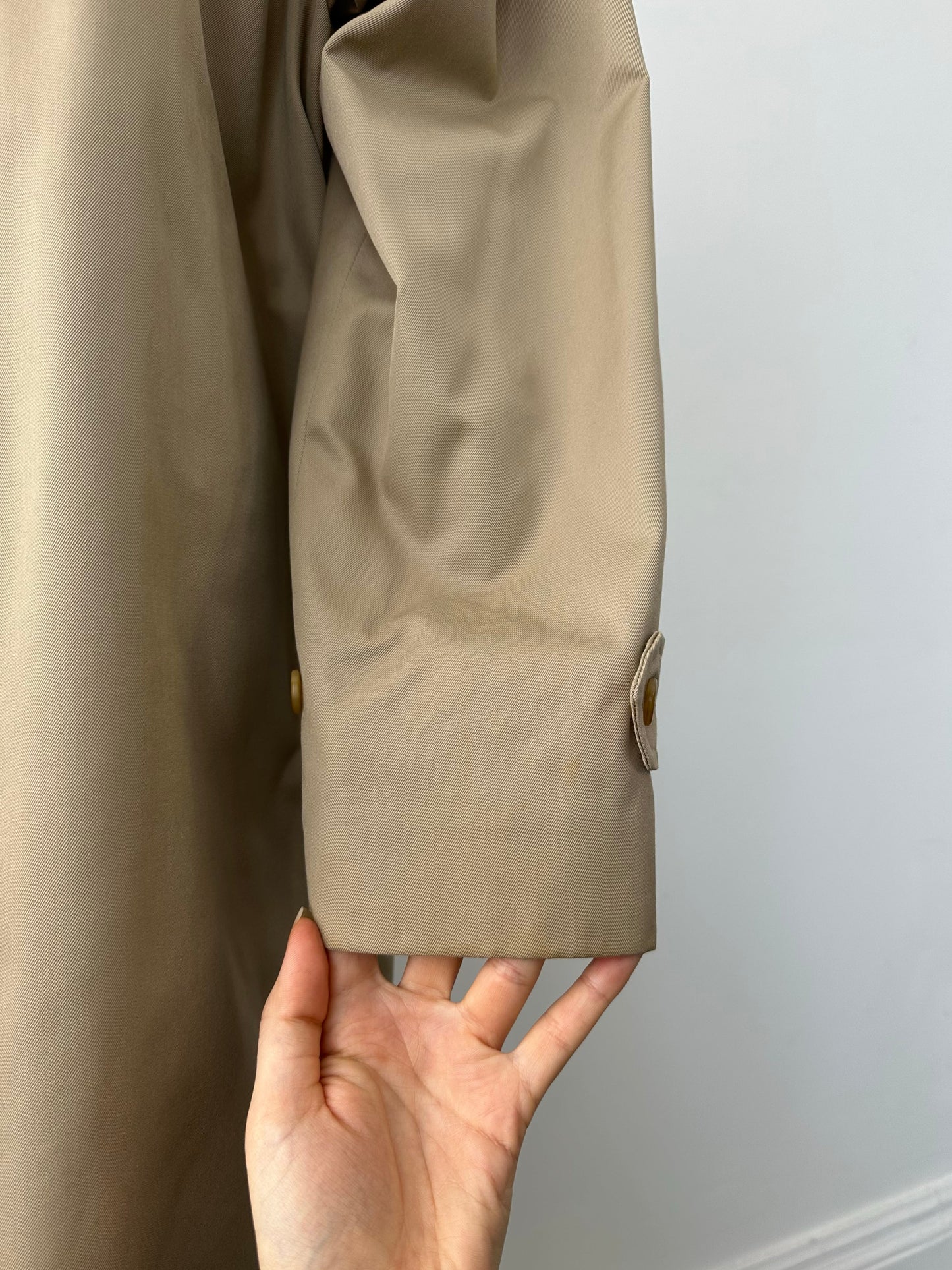 Burberry 1990s pure cotton high neck trench coat in beige, front view showing classic collar and belted waist.