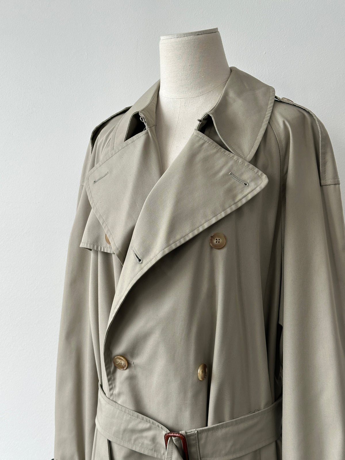 Vintage Italian 1990s high neck belted trench coat in XL, showcasing classic style and tailored details in a natural fabric.