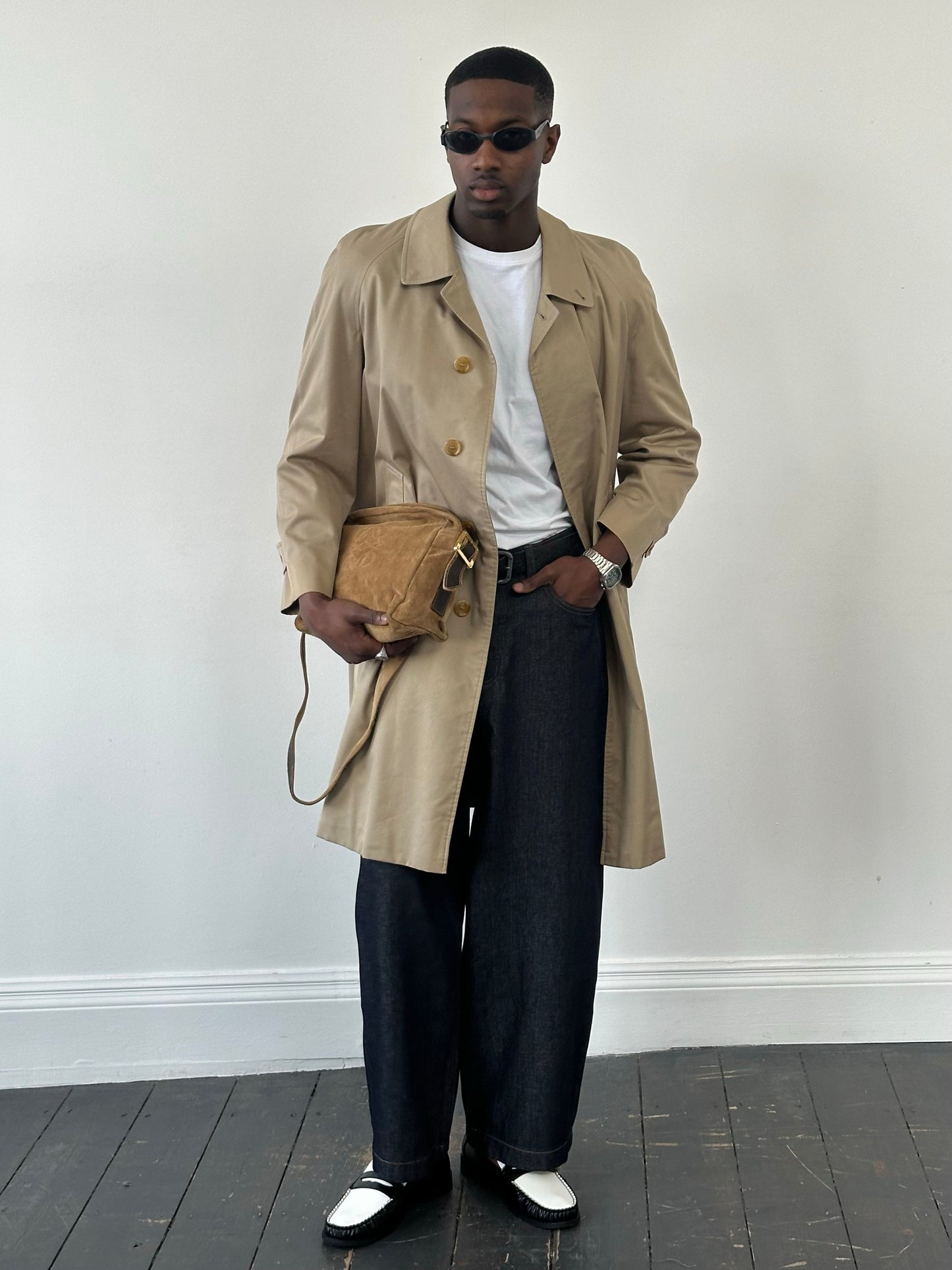 Burberry 1990s pure cotton high neck trench coat in beige, displayed on a hanger with a classic collar and button details.