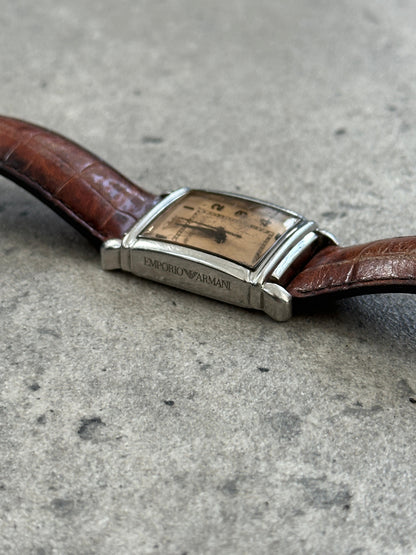 Emporio Armani 2000s leather rectangular quartz watch with a classic design, black leather strap, and silver-tone dial.
