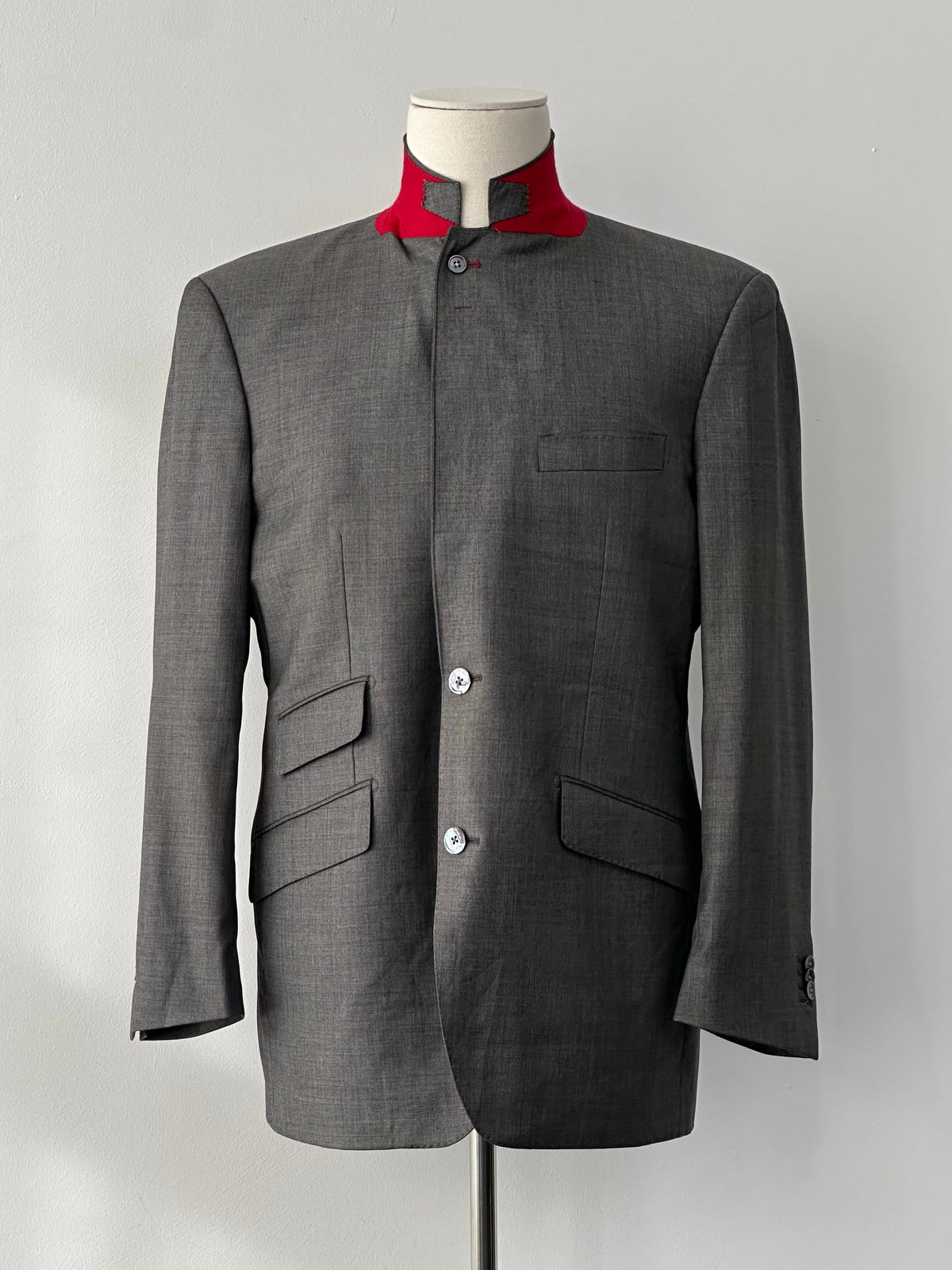 Loro Piana 1990s high neck wool blazer with contrasting collar, tailored fit, in classic beige color, front view showing details.