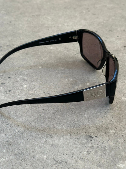 Dolce & Gabbana 2000s rectangle logo sunglasses with black frames and D&G logo on the temples.