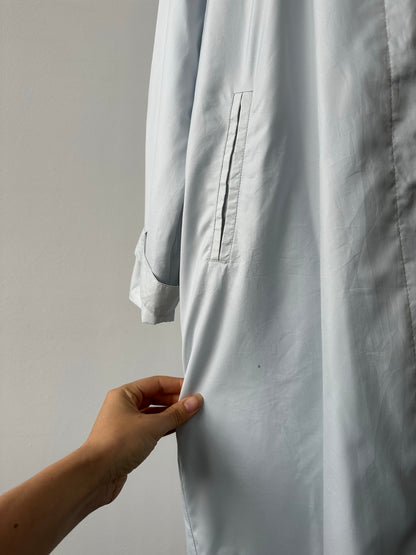 London Fog 1990s XL trench coat with concealed placket, classic beige color, tailored fit, and button details.