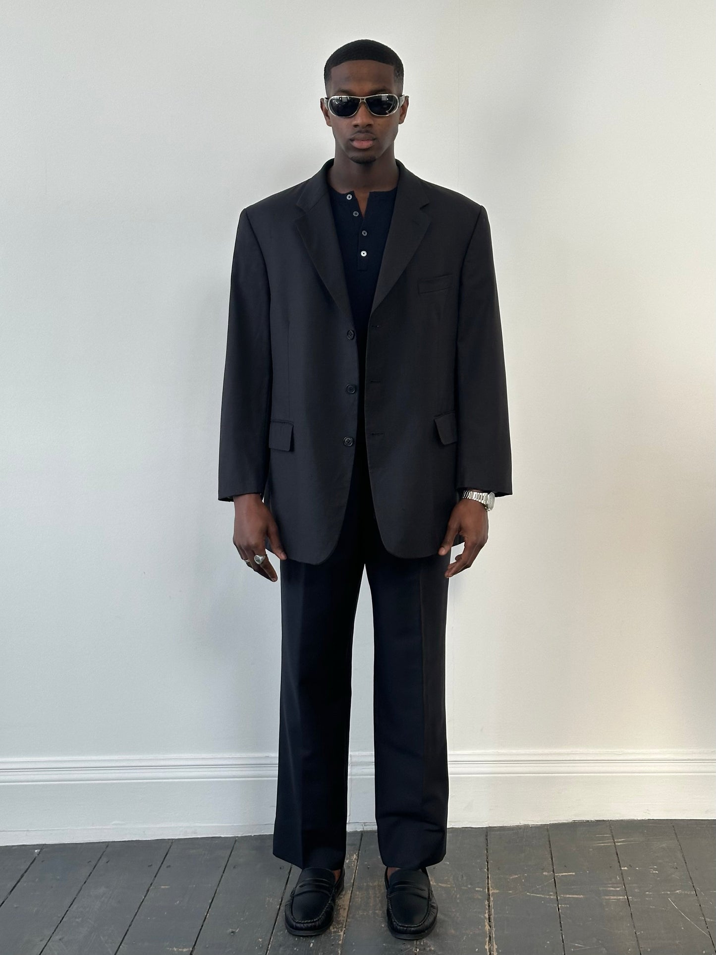 Yves Saint Laurent Pour Homme 1990s high neck wool blazer in size 48R, tailored fit with classic dark color, front view.